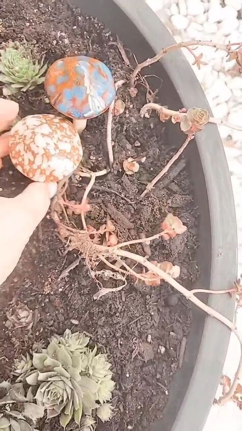 diy plant stand, Adding mushroom decor to the planter