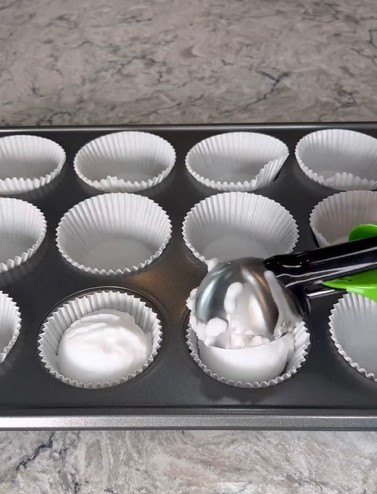 Adding the baking soda to baking cups
