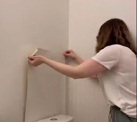 Applying wallpaper to the wall