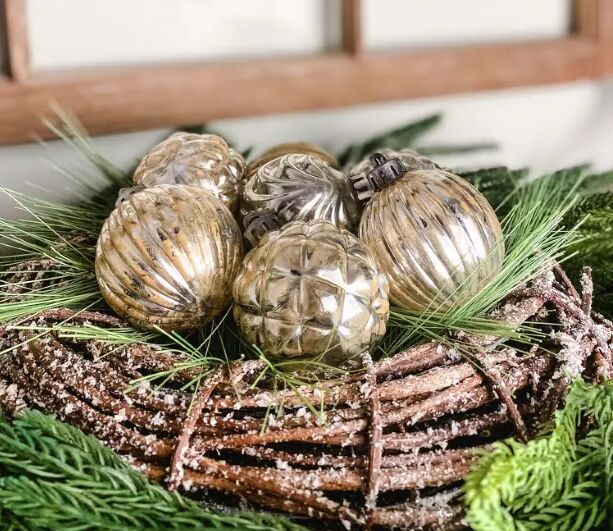 Mercury glass ornaments in a nest