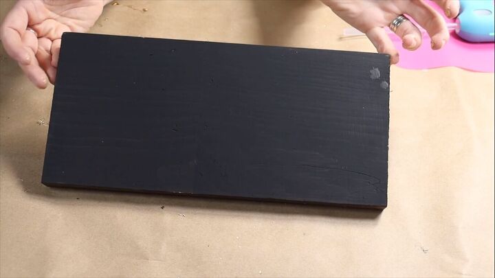 Painted wood block with a black base coat