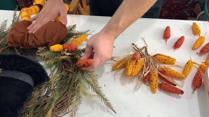 Add corn and raffia pieces