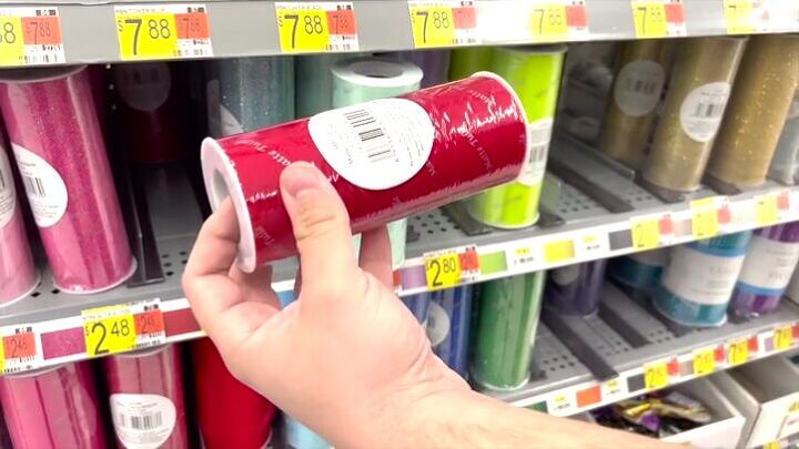 Colorful rolls of tulle on shop shelf