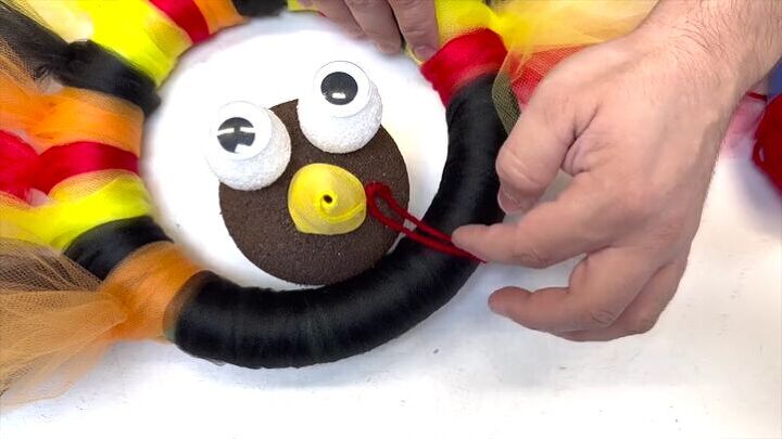 Use a piece of red yarn as the waddle