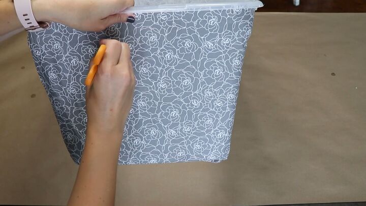 decorating plastic storage bins, Poke through the fabric at the spot where you drilled the handle holes
