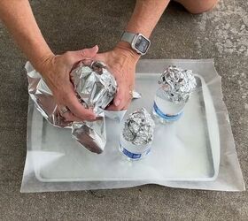 Cover the water bottle and foil head with another piece of foil