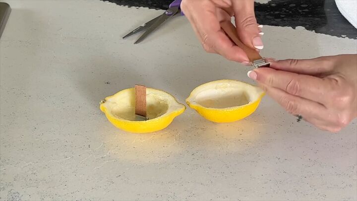 how to make homemade candles, Test the wick stands properly in the citrus peel candle holder