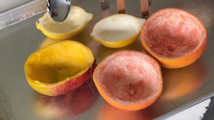 how to make homemade candles, Pour Wax Into the Fruit