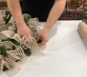Use the pine tips to tie the mesh pieces the the wreath form