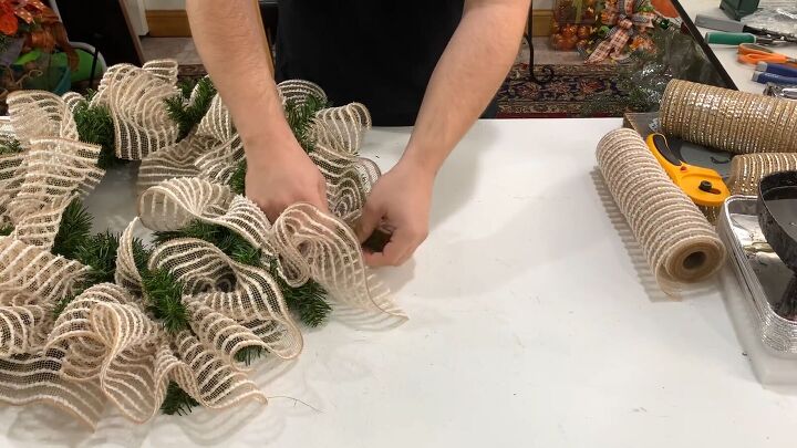 Use the pine tips to tie the mesh pieces the the wreath form