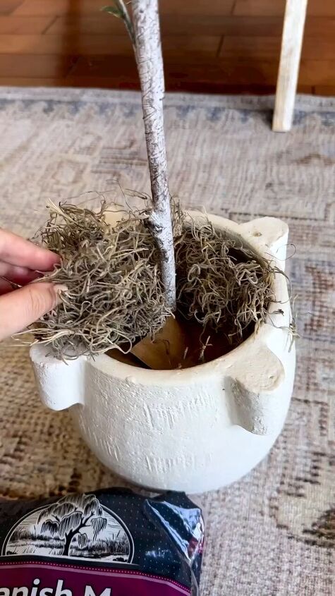 how to repot a fake plant, Adding moss to the pot