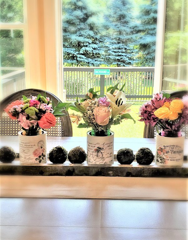 repurpose cans and jars, recycled cans as a centerpiece