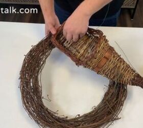 Attaching the cornucopia to the wreath with floral wire