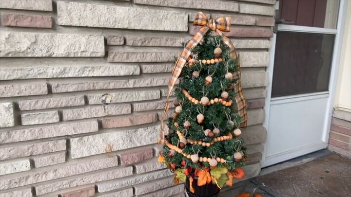 wood bead garland, Transforming a mini Christmas tree into fall porch decor