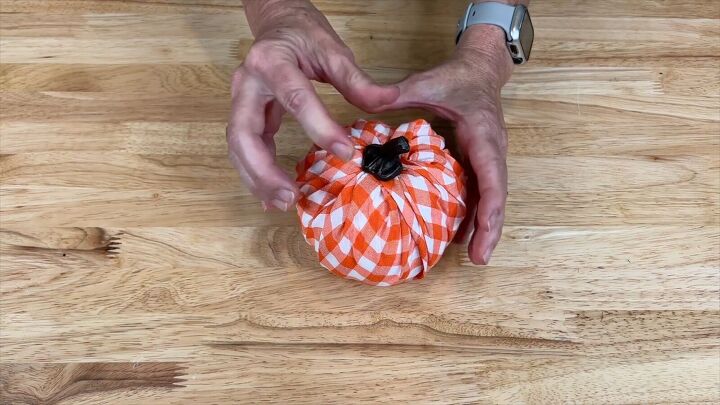 Reattach the stem to the wrapped pumpkin
