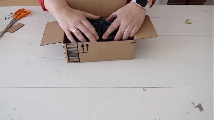 Placing the Christmas lights in a box