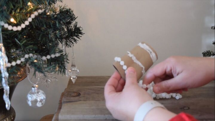 Storing Christmas beads around a toilet roll tube