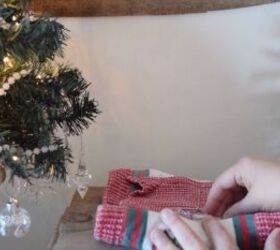 Rolling the breakable ornaments in Christmas towels