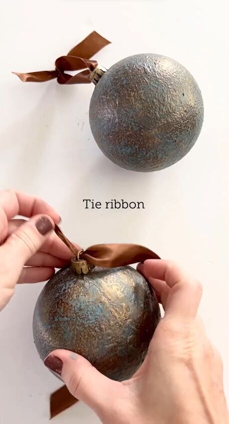 Tying a ribbon around the ornaments