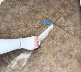 Scrubbing with the DIY grout cleaner