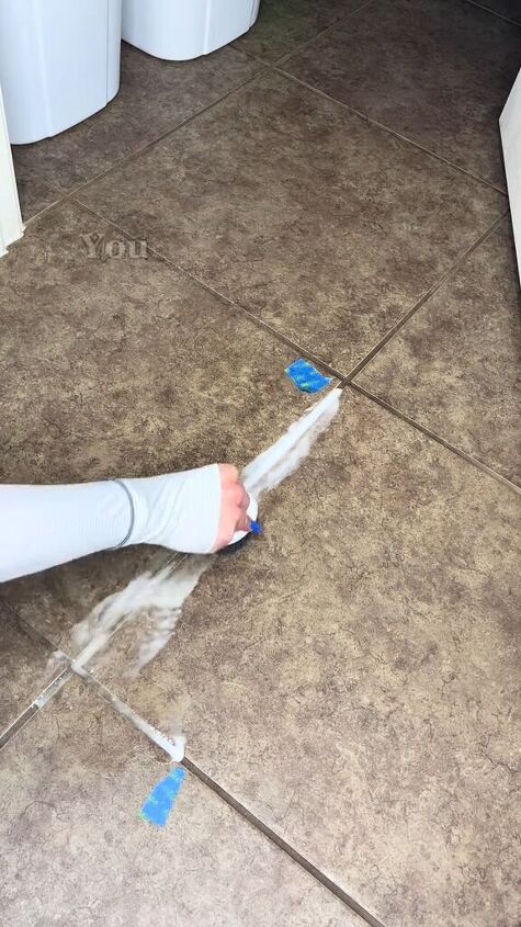Scrubbing with the DIY grout cleaner