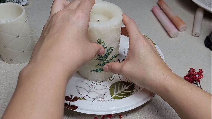 Sticking the ferns to the candle