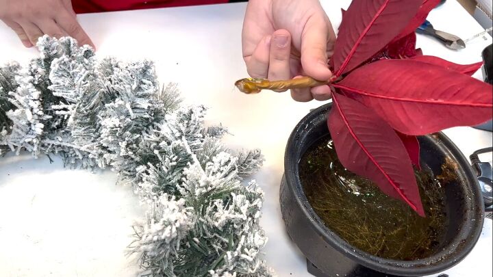 Dipping the poinsettia ends in the glue skillet