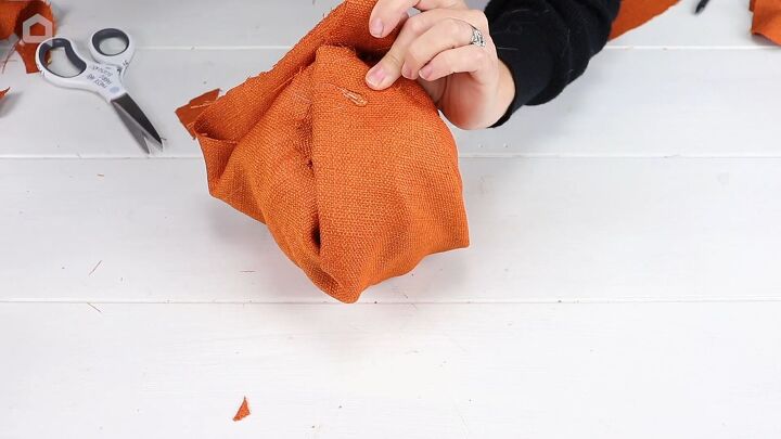 Wrapping the Pumpkin with Orange Fabric