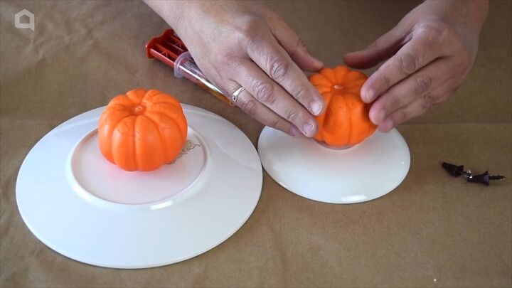 Attaching a pumpkin to the plate with epoxy