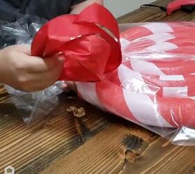 Wrapping the lollipop in cellophane