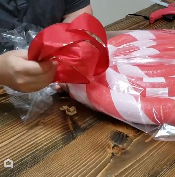 Wrapping the lollipop in cellophane