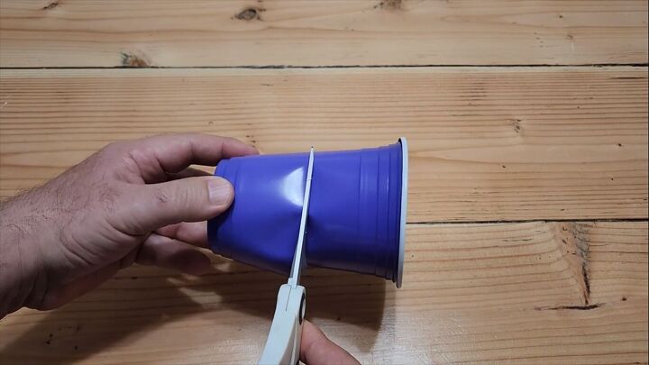 Cutting around the cup with scissors