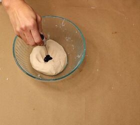 Adding chocolate brown food coloring to the dough