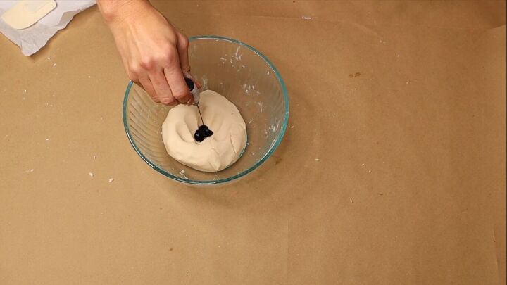 Adding chocolate brown food coloring to the dough