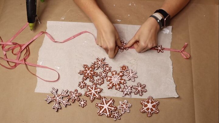 Gluing the snowflakes onto the ribbon
