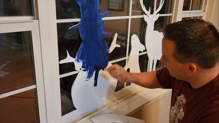 Painting the back of the shapes a dark blue
