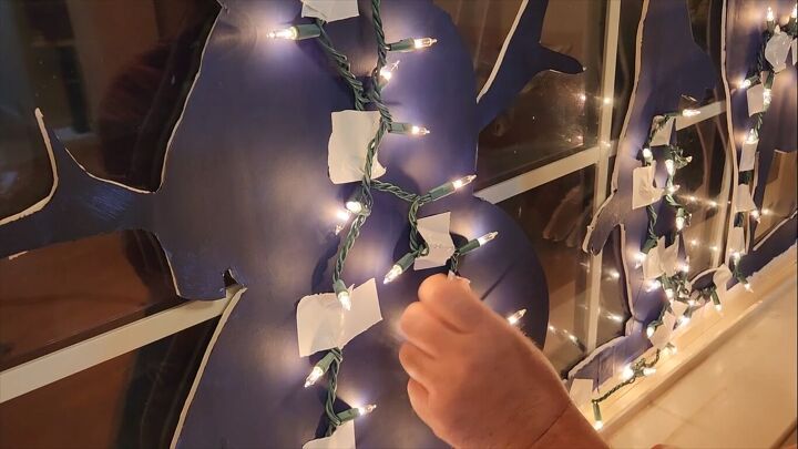 Attaching fairy lights to the back of the silhouette shapes