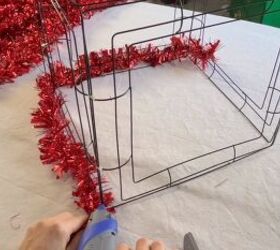 Wrapping tinsel garland around the box