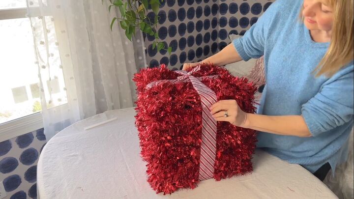 Adding ribbon to the gift box