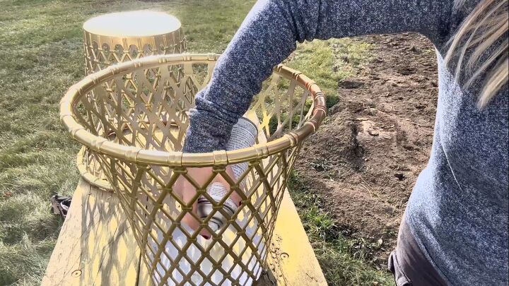 Spray-painting the waste paper baskets gold