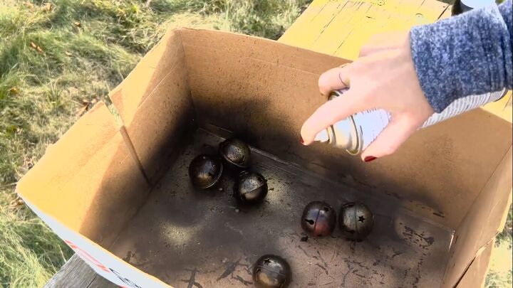Spray-painting the jingle bells gold