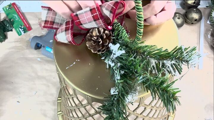 Gluing embellishments to the top of the bells