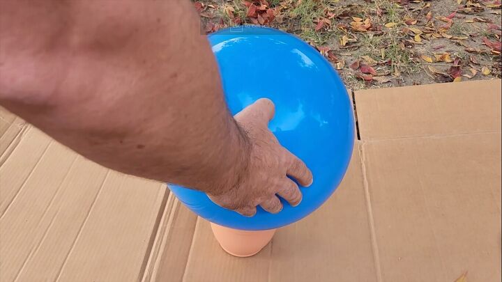 Setting the ball on a plant pot