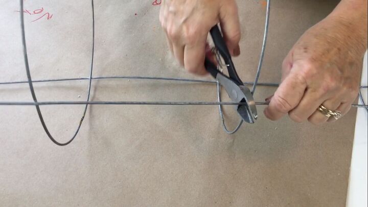 Cutting off the top of the tomato cage
