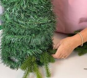 Adding evergreen picks to the topiary