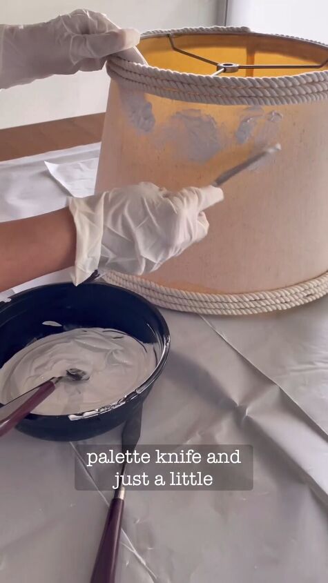 Applying wall putty to the lampshade