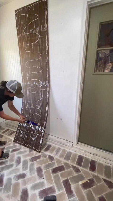 mudroom makeover, Applying adhesive to the beadboard