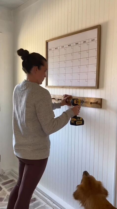 mudroom makeover, Screwing the clothes hooks into the wall