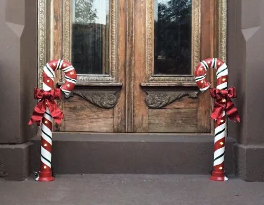 DIY giant candy canes either side of a door