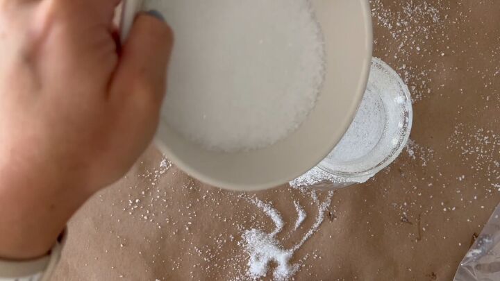 Fill the bottom of the jar with fake snow